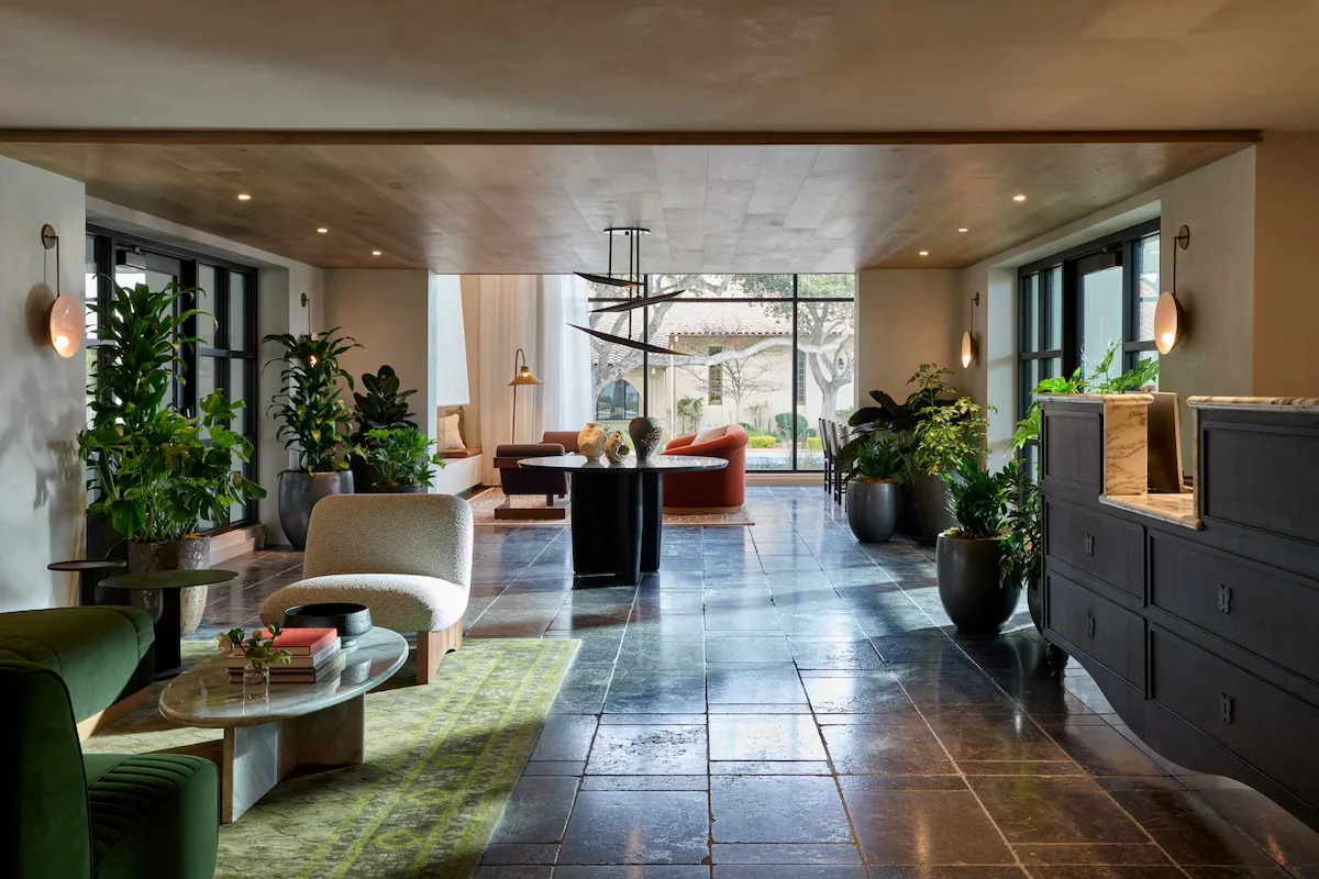 Hotel lobby with honed Belgian bluestone flooring, seating and planting