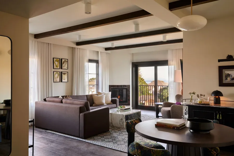 Guest room with fireplace and balcony doors