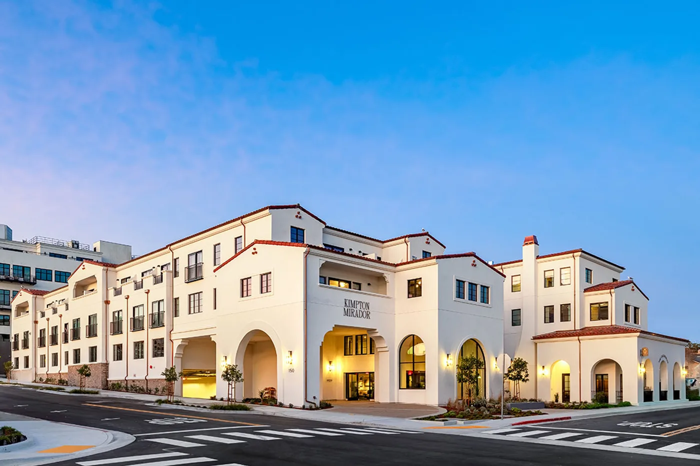The Kimpton Mirador hotel exterior at dusk